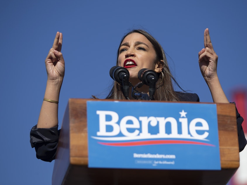 caption: Rep. Alexandria Ocasio-Cortez, D-N.Y., speaks during a rally for presidential hopeful Sen. Bernie Sanders in Queens, N.Y., on Saturday.