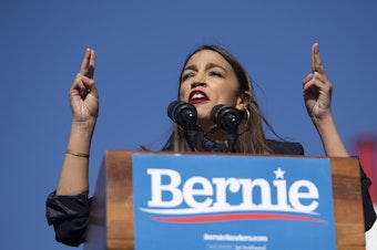 caption: Rep. Alexandria Ocasio-Cortez, D-N.Y., speaks during a rally for presidential hopeful Sen. Bernie Sanders in Queens, N.Y., on Saturday.