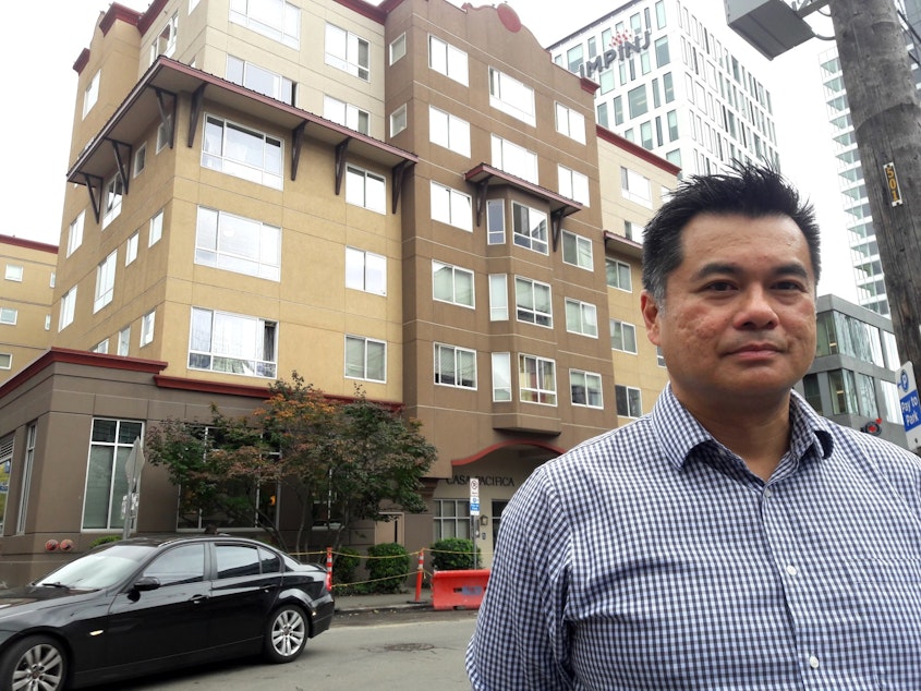 caption: Richard Loo, of Bellwether Housing, stands in front of Casa Pacifica, an affordable housing project built in South Lake Union back when land there was cheap.