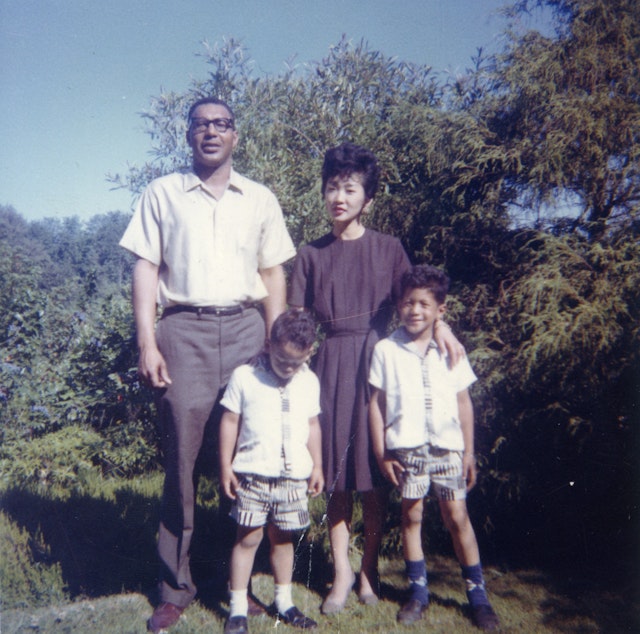 caption: Bruce Harrell (bottom left) pictured here with his family, was raised in Seattle's central area