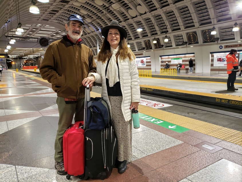 caption: Francisco and Judy Veramendi, visiting from Illinois, were worried delayed trains would mean a late arrival at SeaTac Airport on Monday, January 6th, 2020. 
