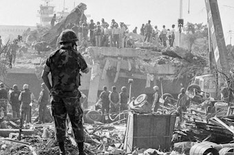 caption: In October 1983, rescuers probe the wreckage of the U.S. Marine command building near the Beirut airport, a day after a terrorist attack killed 241 U.S. service members.