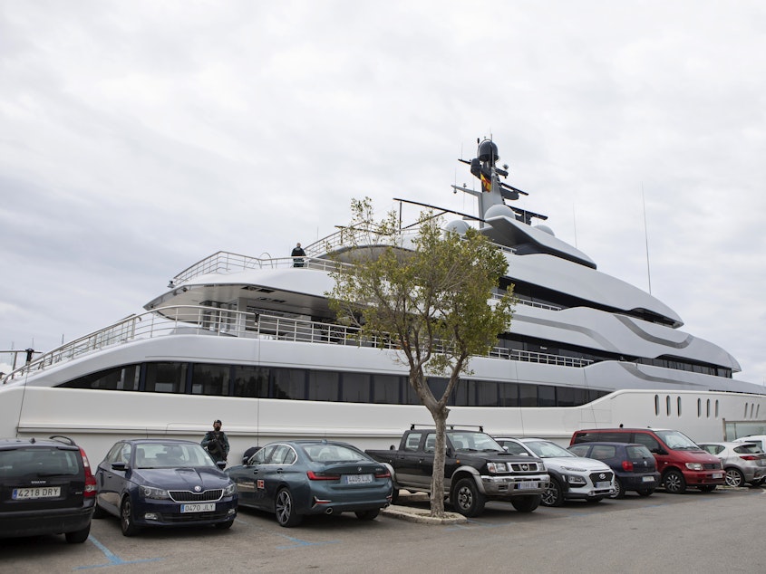 caption: A Civil Guard stands by the yacht called Tango in Palma de Mallorca, Spain, on Monday. U.S. federal agents and Spain's Civil Guard are searching the yacht owned by a Russian oligarch.