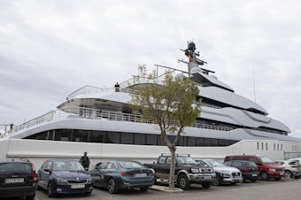 caption: A Civil Guard stands by the yacht called Tango in Palma de Mallorca, Spain, on Monday. U.S. federal agents and Spain's Civil Guard are searching the yacht owned by a Russian oligarch.