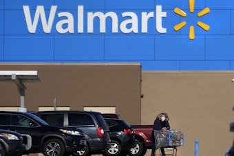 caption: Walmart is no longer requiring employees to wear masks unless they are mandated by local regulations.