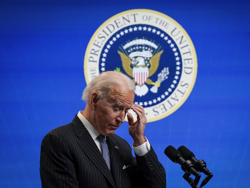 caption: President Biden pauses while speaking after signing an executive order related to manufacturing at the White House Jan. 25. Biden is off to a fast start, but is running into resistance in Congress.