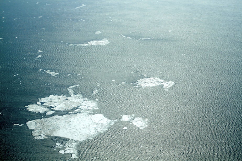 caption: A view of the sea near Kivalina, Alaska, in May 2014. Normally the ice would have been solid into June.