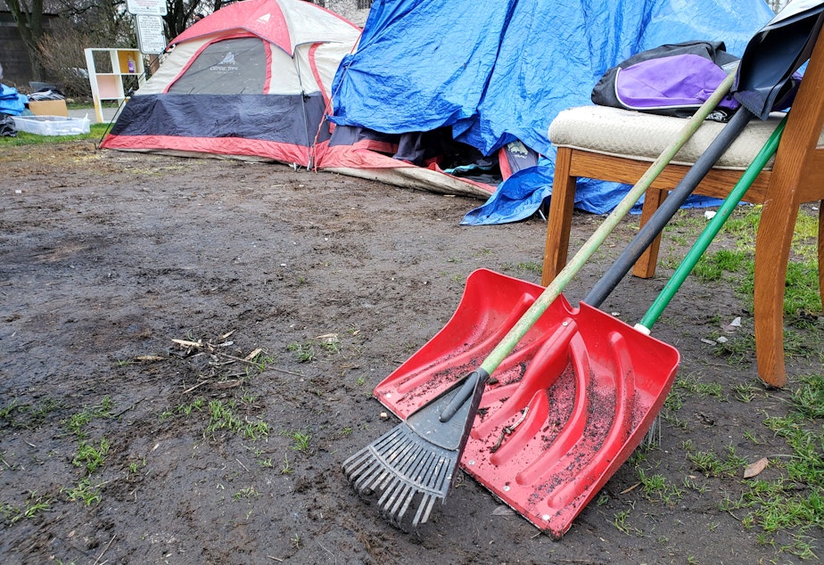 caption: Matt Havens used this rake and shovel to clean his area of the camp before the city arrived on Thursday, February 17, 2022.