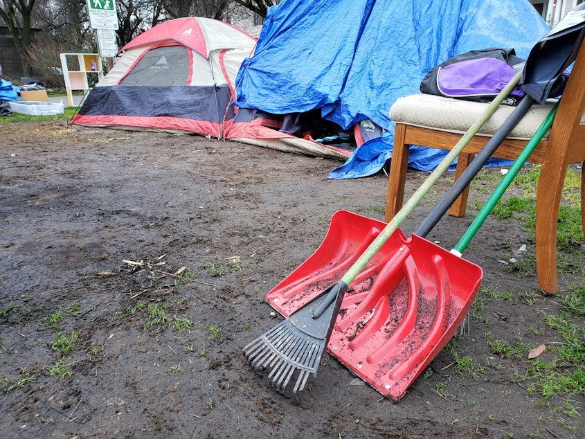 caption: Matt Havens used this rake and shovel to clean his area of the camp before the city arrived on Thursday, February 17, 2022.