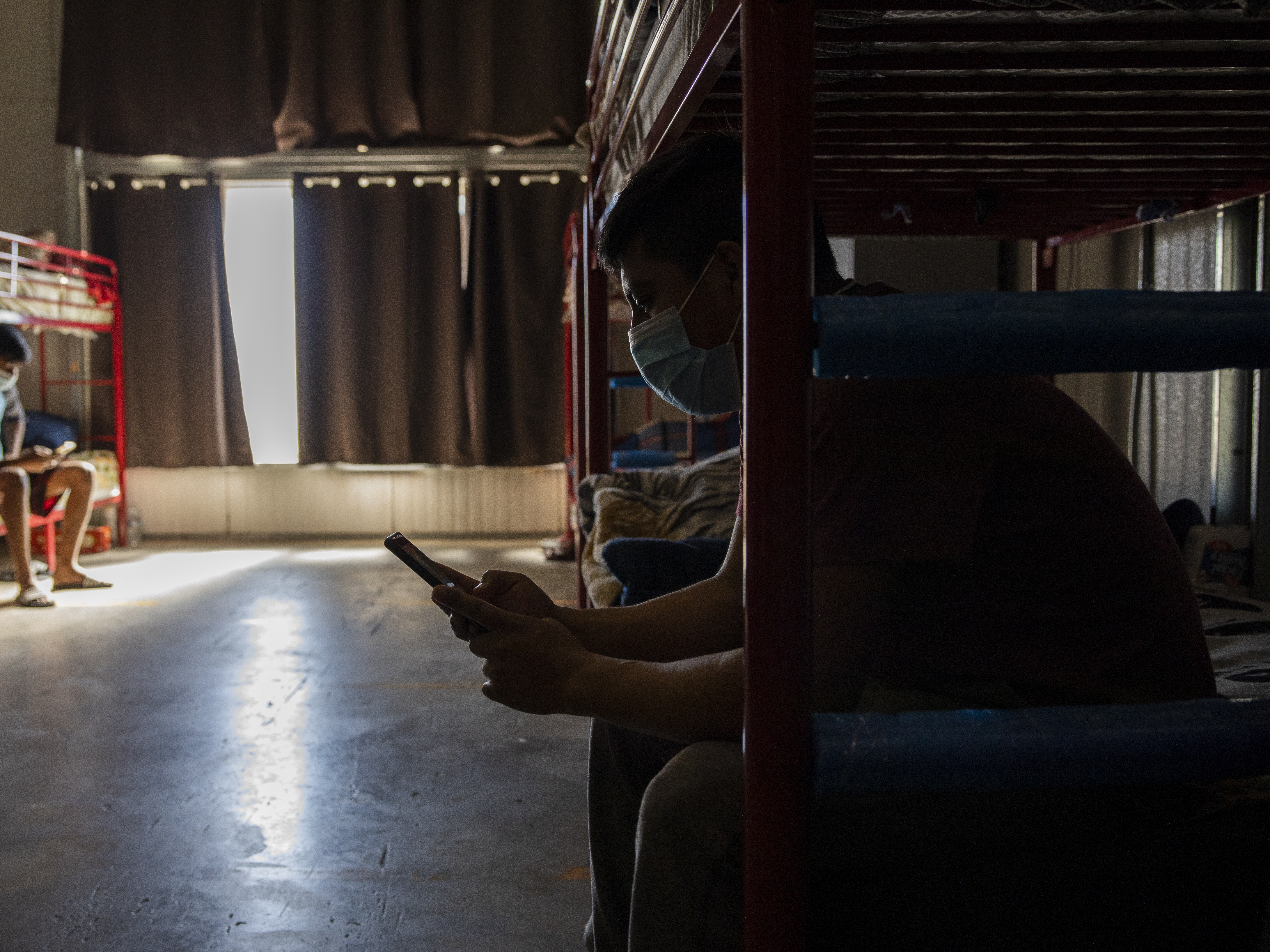 caption: Warehouse workers often labor in extremely hot conditions in California, as do many others whose workplaces are indoors. The state has been considering new rules protecting them when temperatures soar to dangerous levels, but political headwinds have left the rules in limbo.