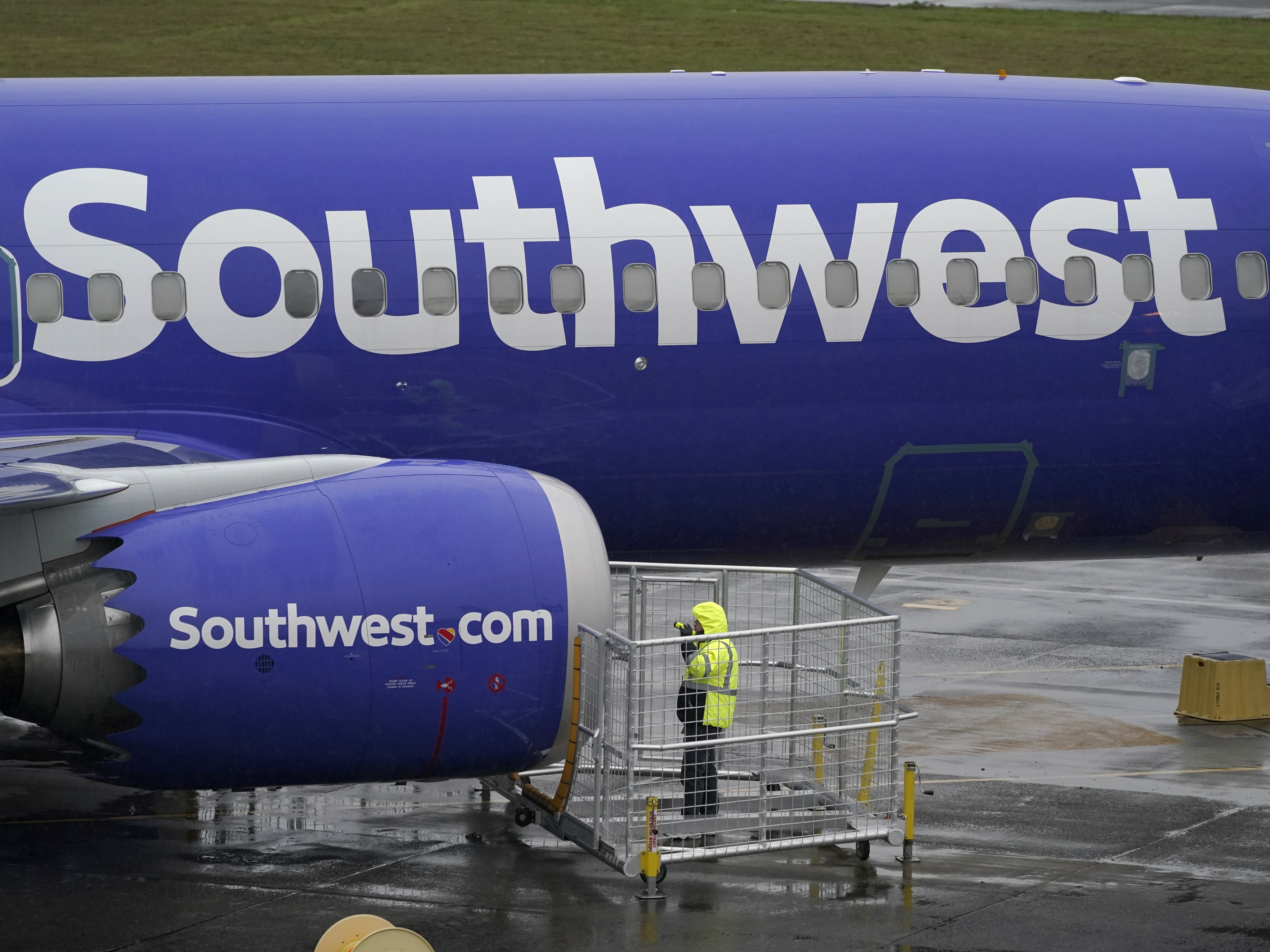caption: A Southwest Airlines plane, seen in November 2020. A flight attendant for Southwest was allegedly struck by a passenger and lost two teeth in the latest in a rash of violent attacks on planes.