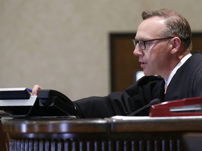 caption: Judge Thad Balkman will rule Monday in the Johnson & Johnson opioid trial.