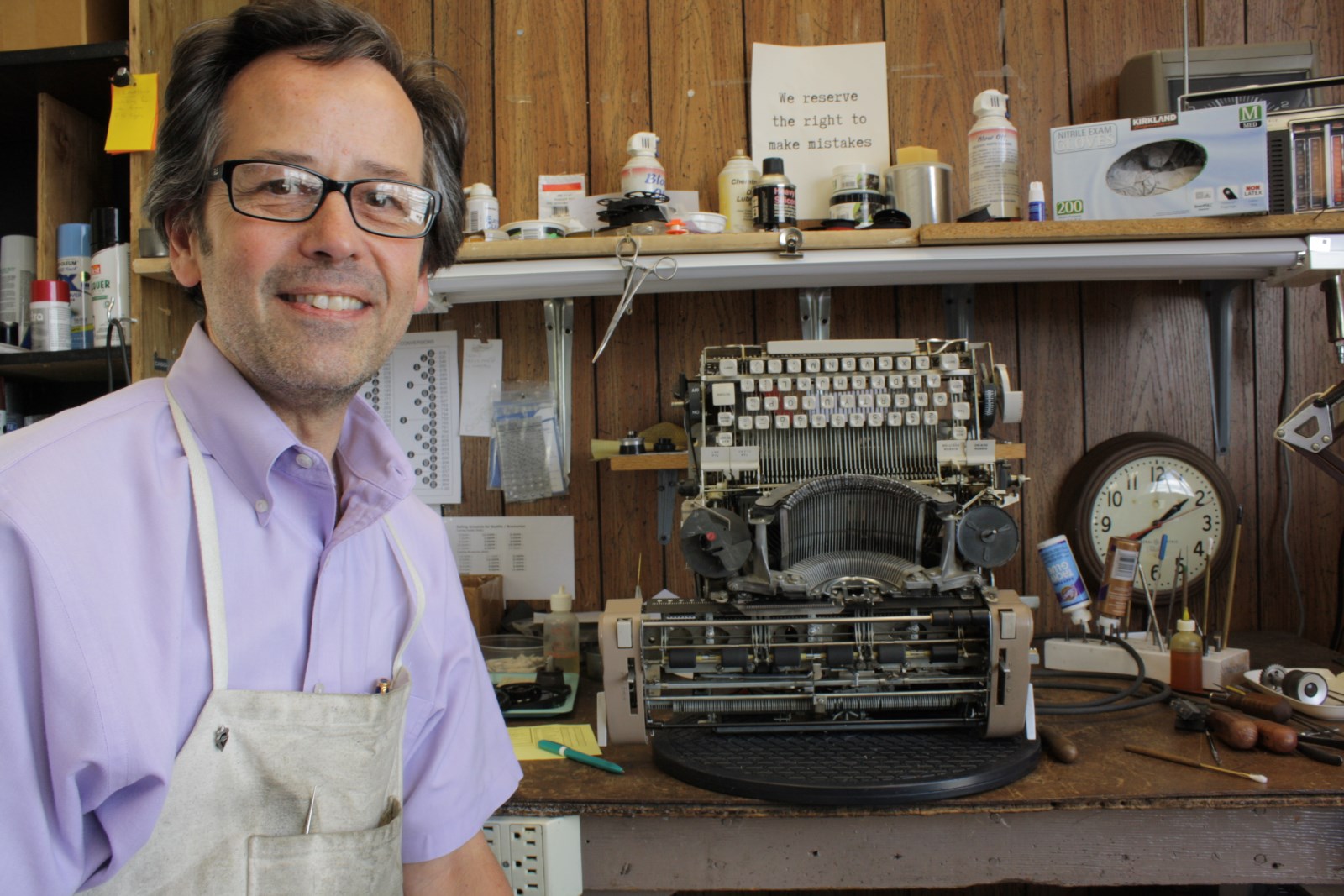 caption: Paul Lundy repairs typewriters for a living.