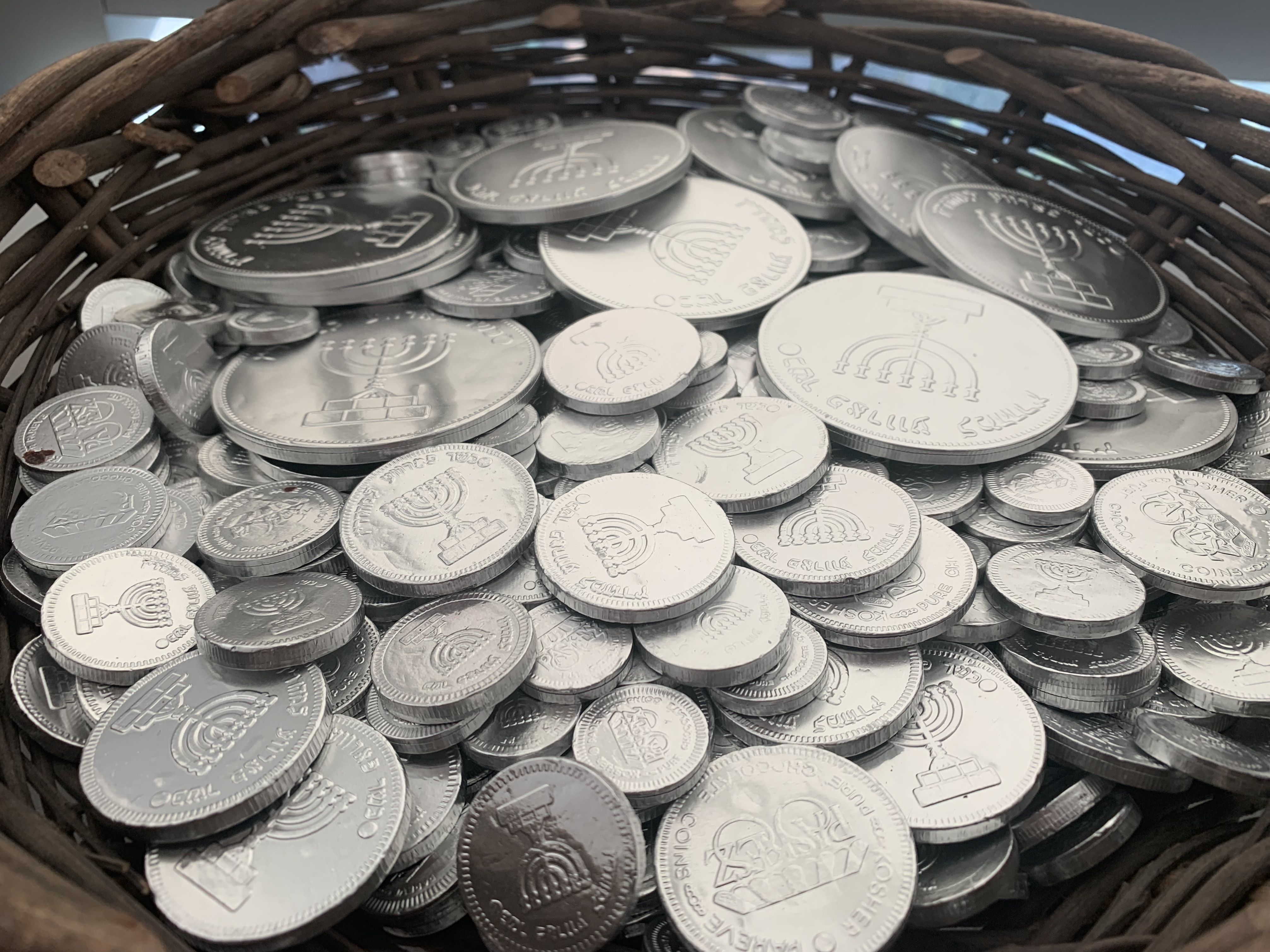 caption: Gelt are chocolate coins traditionally given out during Hanukkah. NuRoots, the Jewish Federation of Greater Los Angeles' young adult initiative, has baskets of gelt to hand out at its events.