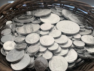 caption: Gelt are chocolate coins traditionally given out during Hanukkah. NuRoots, the Jewish Federation of Greater Los Angeles' young adult initiative, has baskets of gelt to hand out at its events.