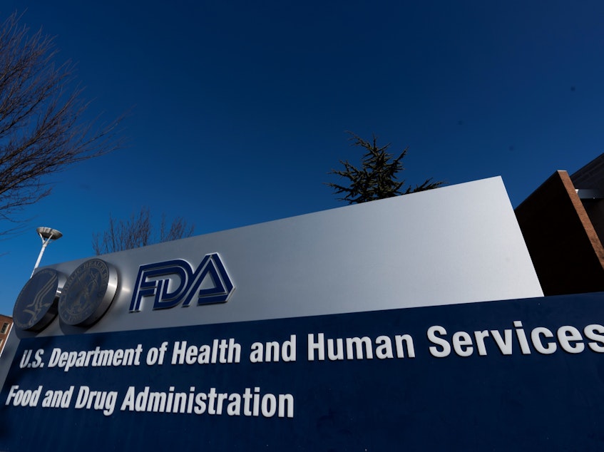 caption: Food and Drug Administration building is shown Thursday, in Silver Spring, Md. A U.S. government advisory panel convened to decide whether to endorse emergency use of Pfizer's COVID-19 vaccine to help conquer the outbreak that has killed close to 300,000 Americans.
