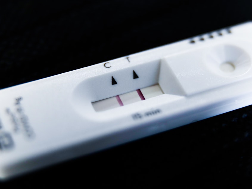 caption: A positive result on a home COVID test. If you catch it once, can you catch it again? Turns out the answer is: Yes.