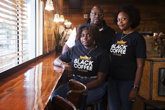 caption: From left, Mikayla Weary, Erwin Weary Sr., and Darnesha Weary are portrayed at their new business, Black Coffee Northwest, on Thursday, October 15, 2020, along Aurora Avenue North in Shoreline.