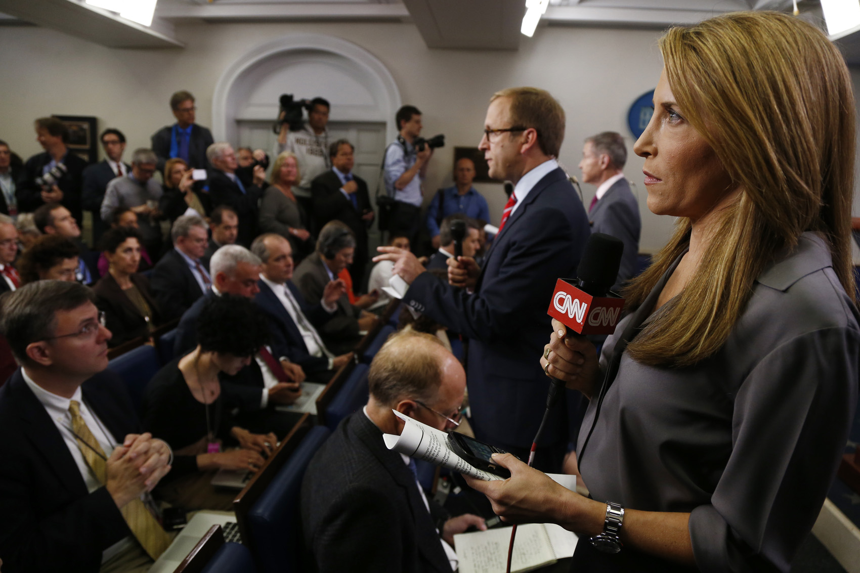 caption: Jessica Yellin of CNN gets ready to do her stand-up from the James Brady Press Briefing Room before President Barack Obama's news conference at the White House in Washington, Tuesday, April 30, 2013. (Charles Dharapak/AP)