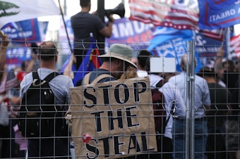 caption: Supporters of President Trump demonstrate at a "Stop the Steal" rally in front of the Maricopa County Elections Department office in Phoenix on Saturday. Domestic terrorism analysts warn that a prolonged fight and Trump's statements about the vote only fuel polarization.