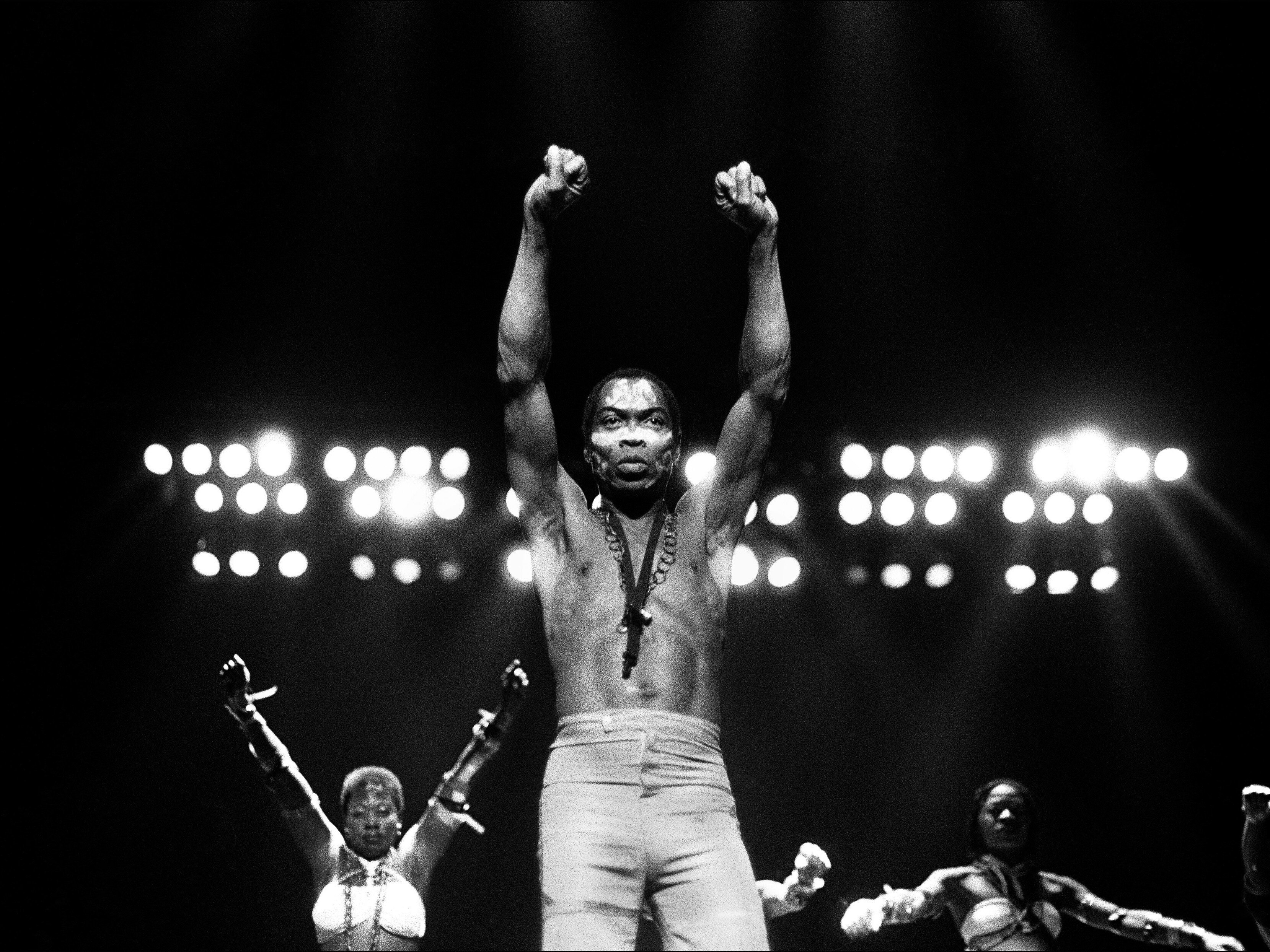 caption: Nigerian superstar Fela Kuti performs at Orchestra Hall in Detroit, Michigan, in 1986. In the past year, the late musician has received two historic honors: the first African artist to receive a Grammy Lifetime Achievement Award and to be named for induction into the Rock &amp; Roll Hall of Fame.