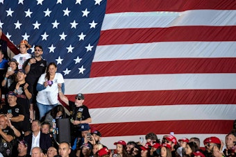 caption: Former President and 2024 Republican presidential hopeful Donald Trump's supporters attend a rally at Ted Hendricks Stadium in Hialeah, Fla., on Nov. 8, 2023.