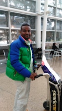 caption: Muwafag Gasim, of Sudan and Seattle, was detained for five hours upon return from a family visit. Gasim is a construction engineer in Seattle.