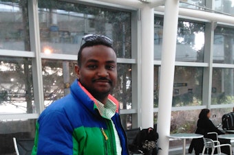 caption: Muwafag Gasim, of Sudan and Seattle, was detained for five hours upon return from a family visit. Gasim is a construction engineer in Seattle.