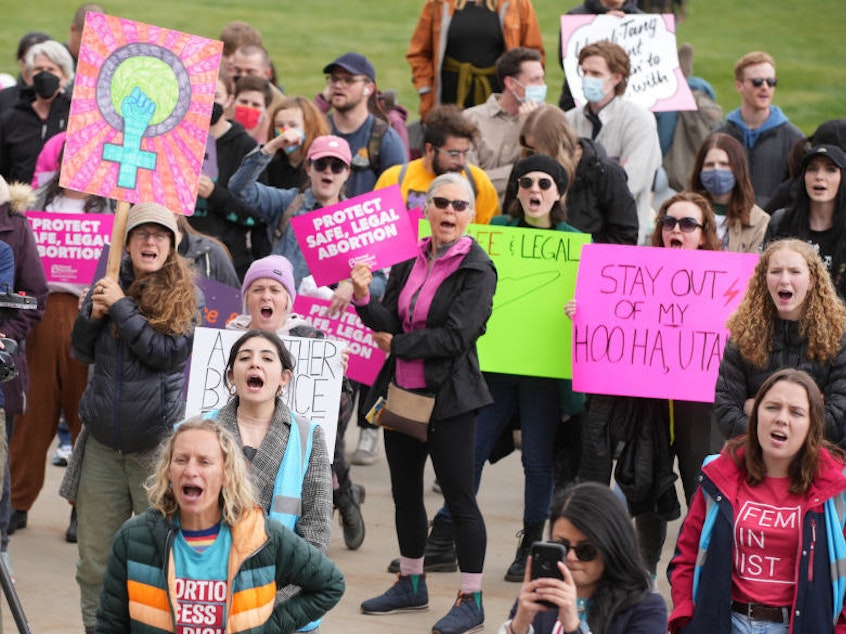 caption: People gather Tuesday at the Utah State Capitol to rally in support of abortion rights in Salt Lake City.