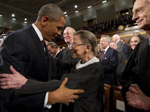 caption: President Barack Obama greets Supreme Court Justice Ruth Bader Ginsburg prior to his 2012 State of the Union address.