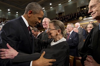 caption: President Barack Obama greets Supreme Court Justice Ruth Bader Ginsburg prior to his 2012 State of the Union address.