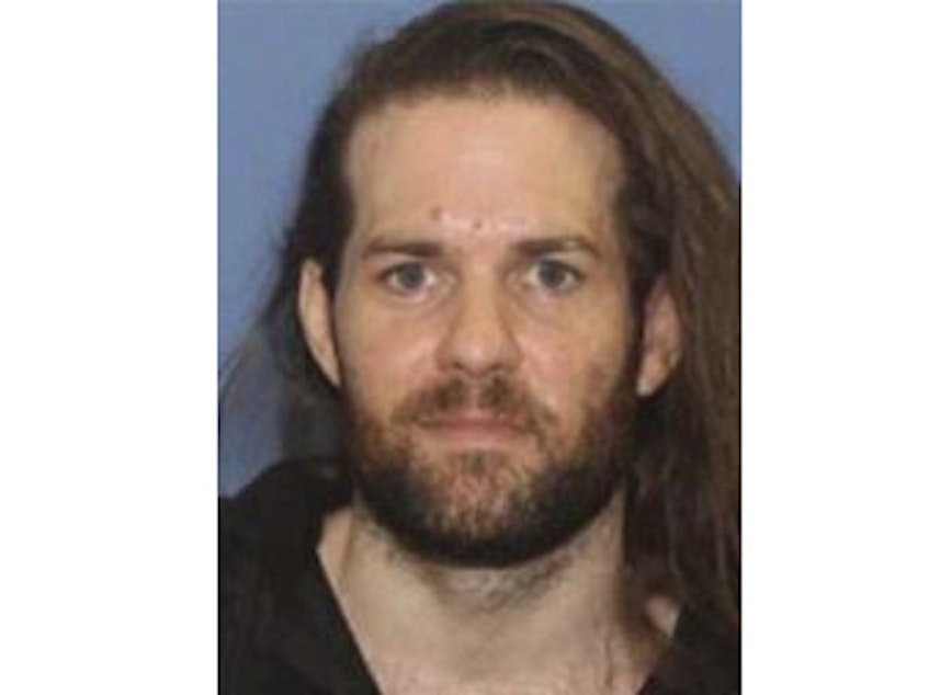 caption: An undated photo provided by the Grants Pass Police Department shows Benjamin Obadiah Foster, who is wanted by authorities for attempted murder, kidnapping and assault.