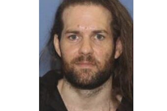caption: An undated photo provided by the Grants Pass Police Department shows Benjamin Obadiah Foster, who is wanted by authorities for attempted murder, kidnapping and assault.