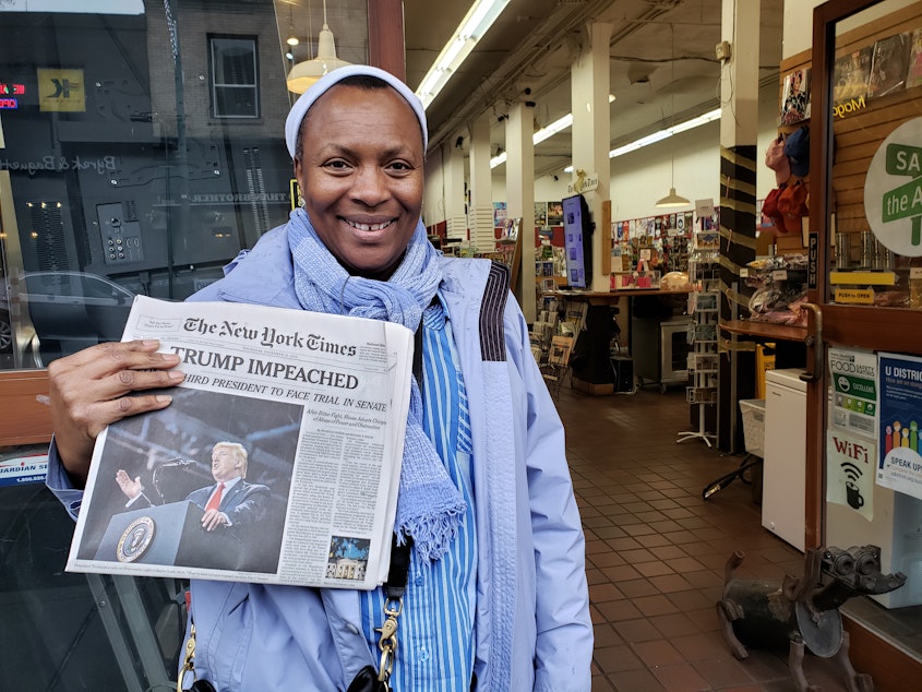 caption: Deilyn Osby Sande bought three copies of The New York Times for her family at Bulldog News on Thursday, December 19, 2019.
