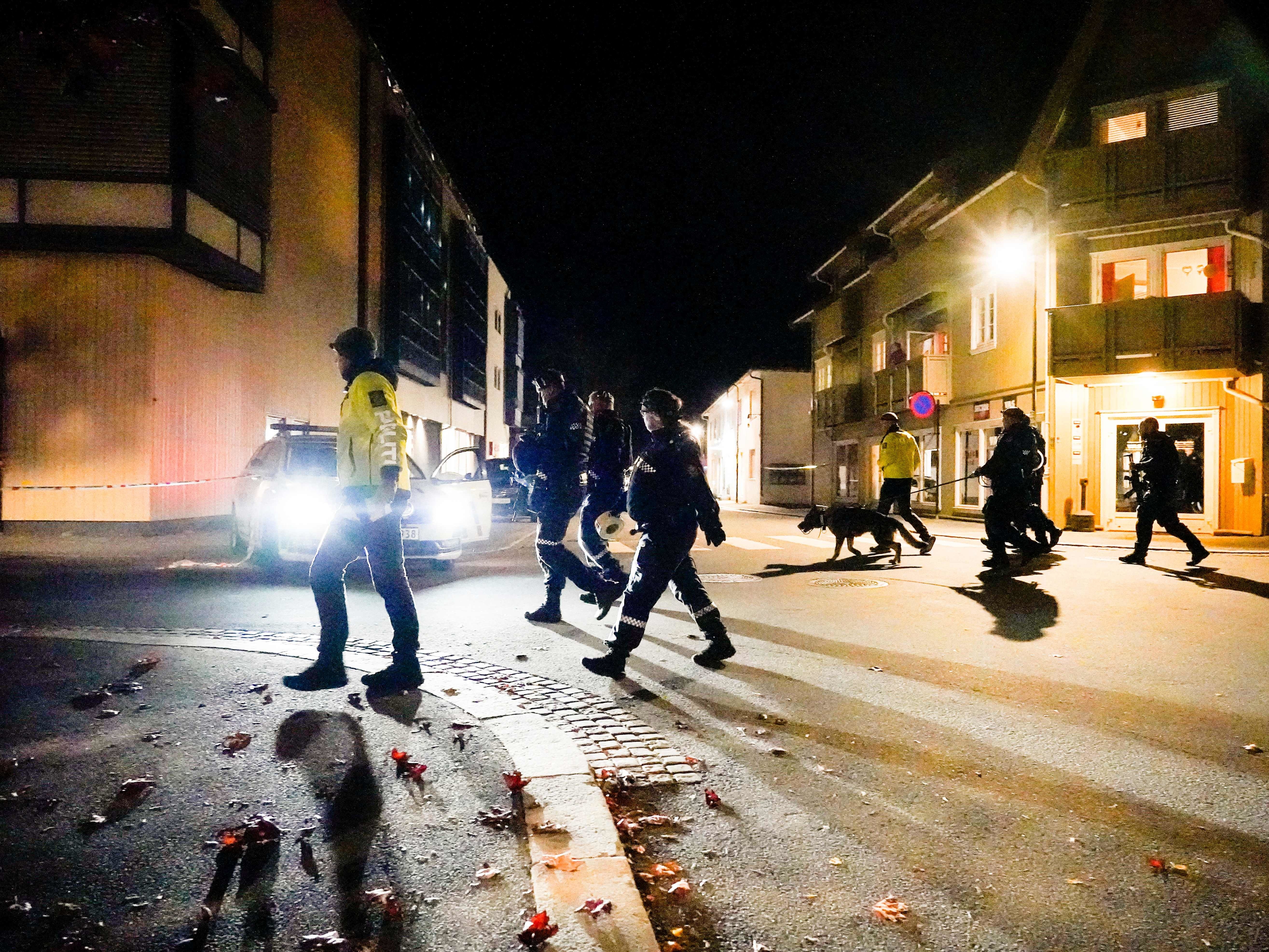 caption: Police officers investigate a scene in Kongsberg, Norway after a man armed with bow killed several people before he was arrested Wednesday.