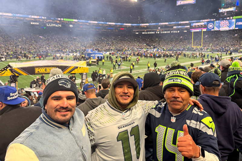 caption: Left to right: Betsaid and Irvin Garcia and their father.