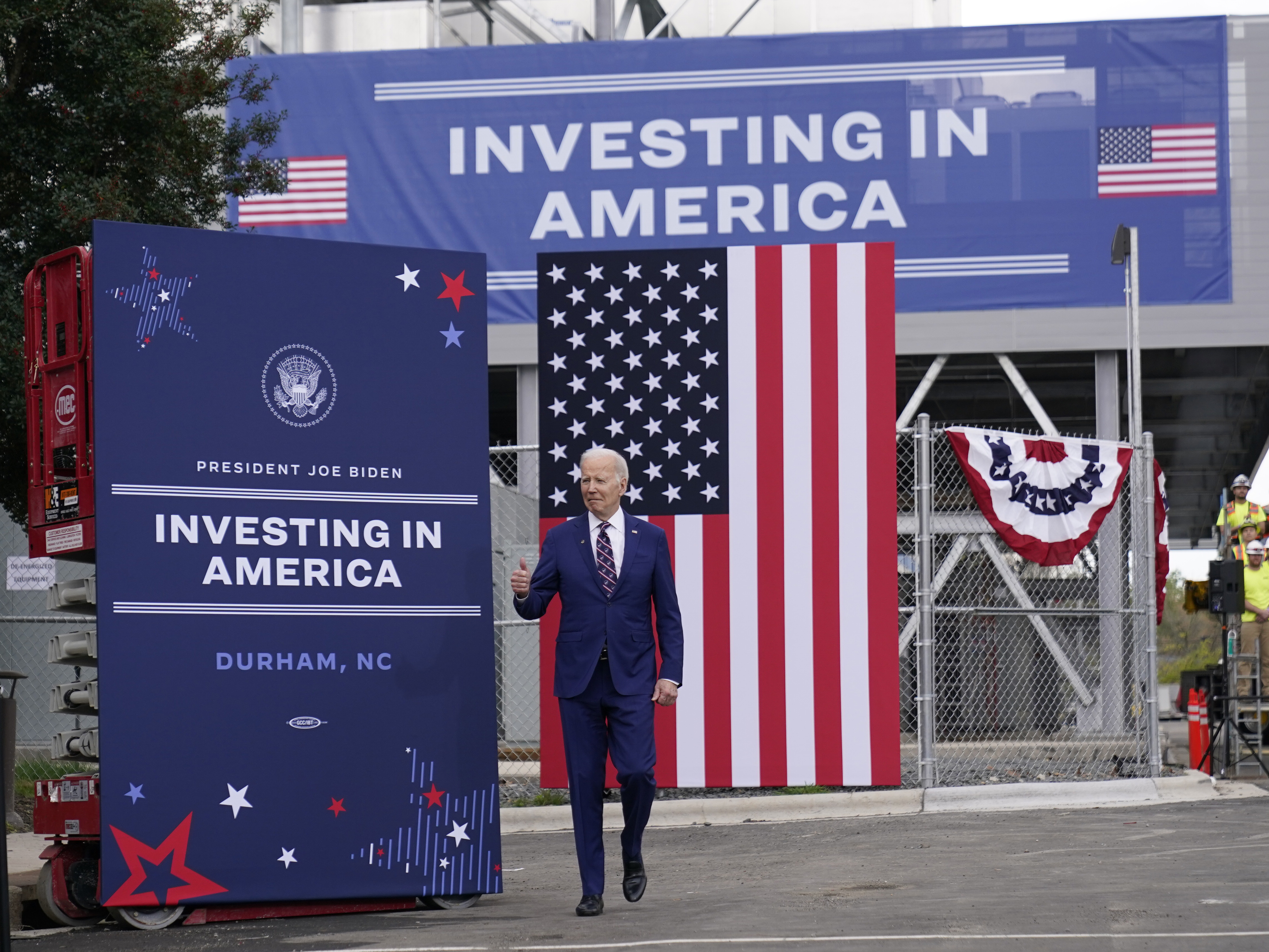 caption: President Biden toured semiconductor manufacturer Wolfspeed Inc. in Durham, N.C., on March 28, 2023 — one of many places where he has touted his industrial policy strategy.
