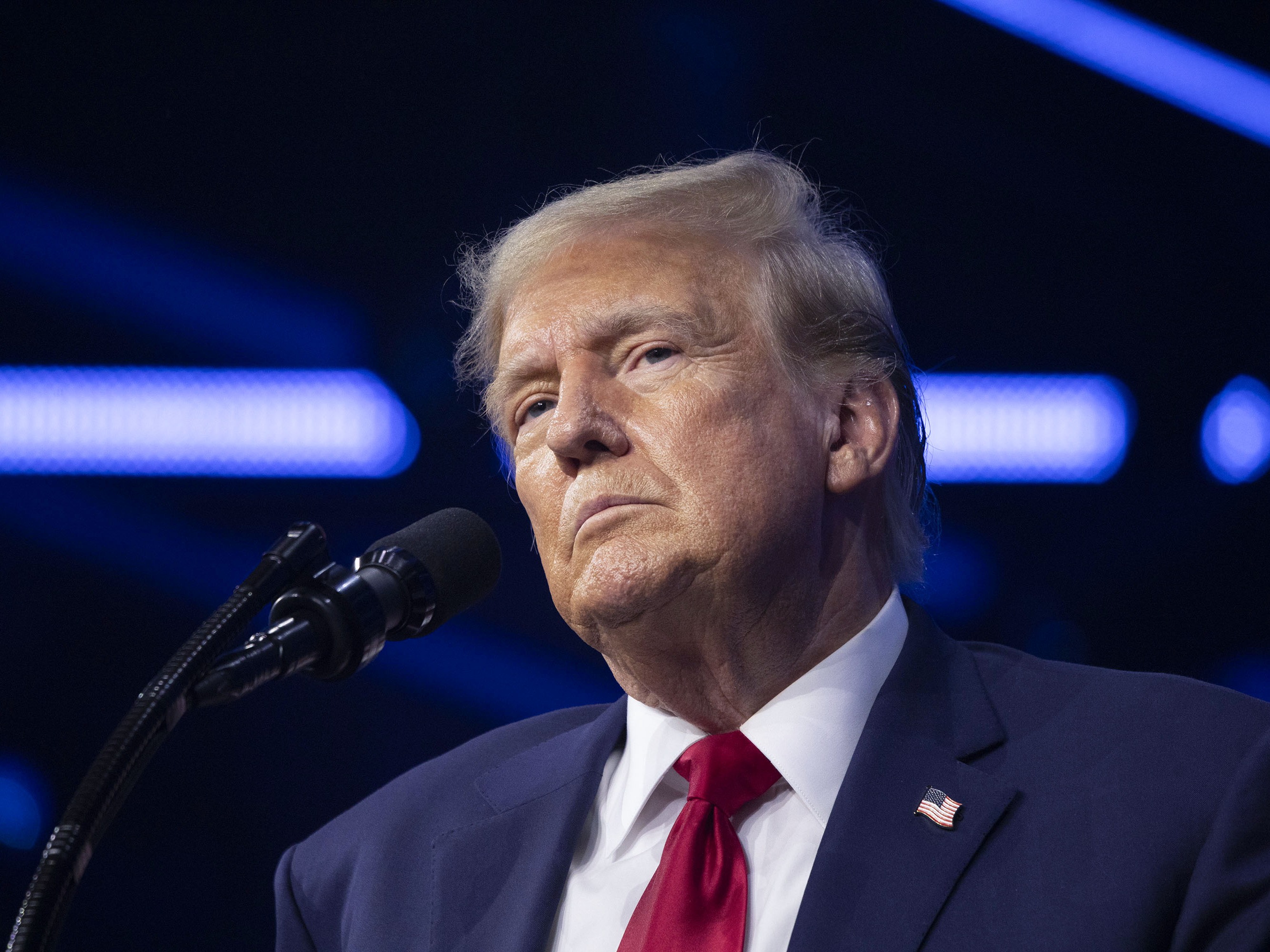 caption: Former President Donald Trump gives the keynote address at Turning Point Action's "The People's Convention" on June 15, 2024, in Detroit, Mich.