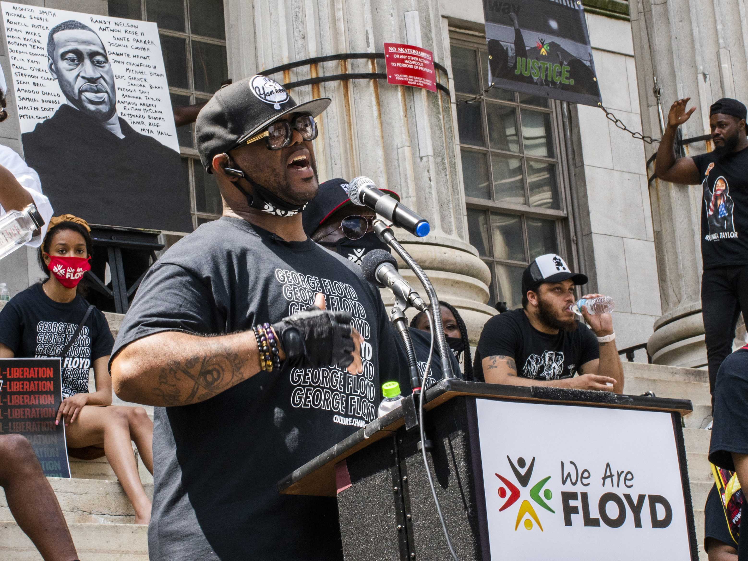 caption: Terrence Floyd, brother of George Floyd, speaks during a rally on Sunday, in Brooklyn borough of New York.