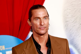 caption: Matthew McConaughey attends a movie premiere on Dec. 12, 2021, in Los Angeles.