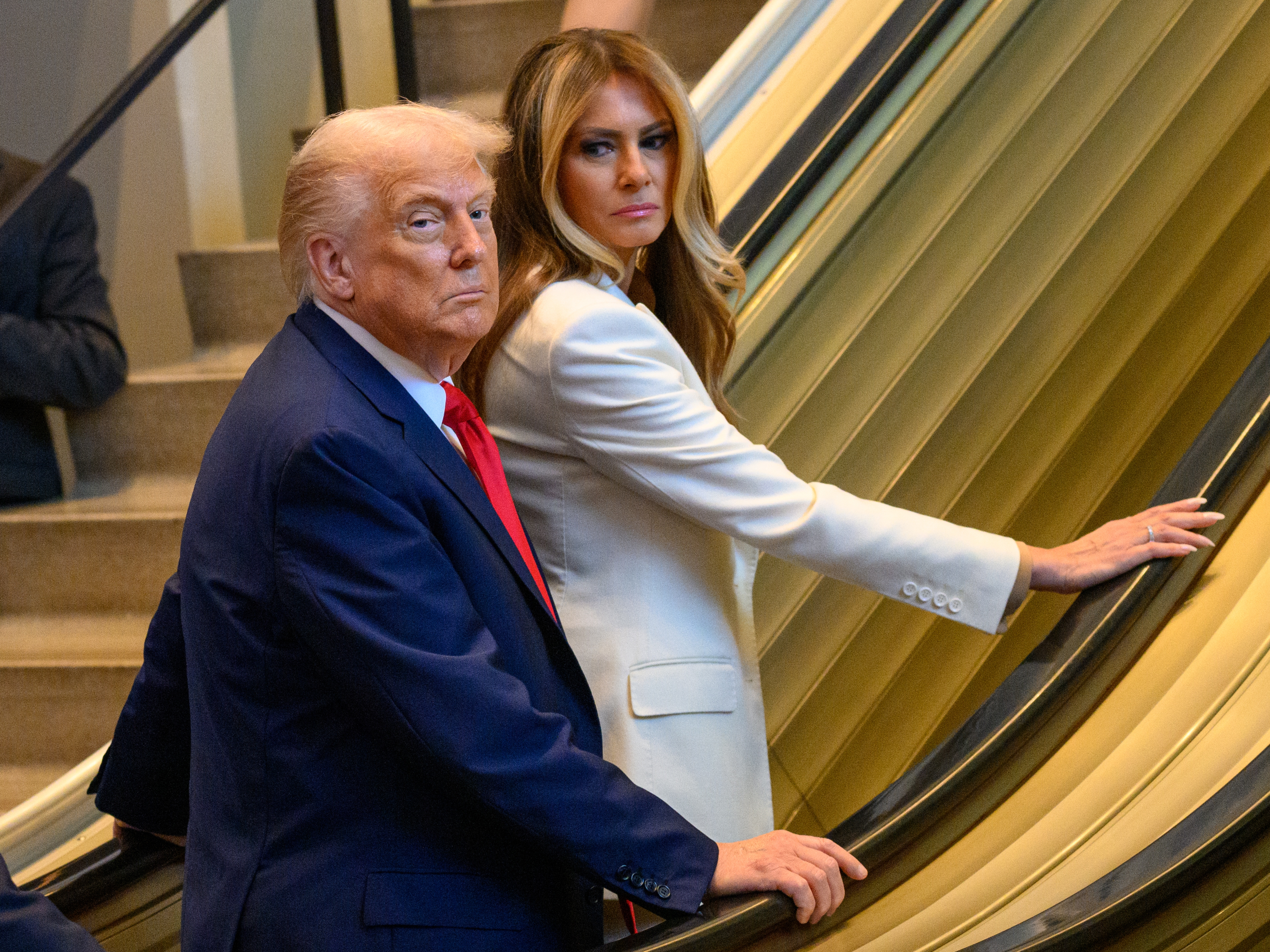 caption: President Trump and first lady Melania Trump had to walk up the escalator Tuesday as they arrived for the 80th session of the U.N. General Assembly in New York City.