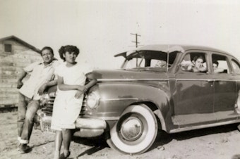 caption: Ricardo "Papu" Ovilla, left, and the family's first car. Ovilla is pictured with his children Martha (next to him) and Aurelia and Rodolfo Sandoval (left to right, inside the car) in a photo taken in 1949 at a labor camp in Escondido, Calif.