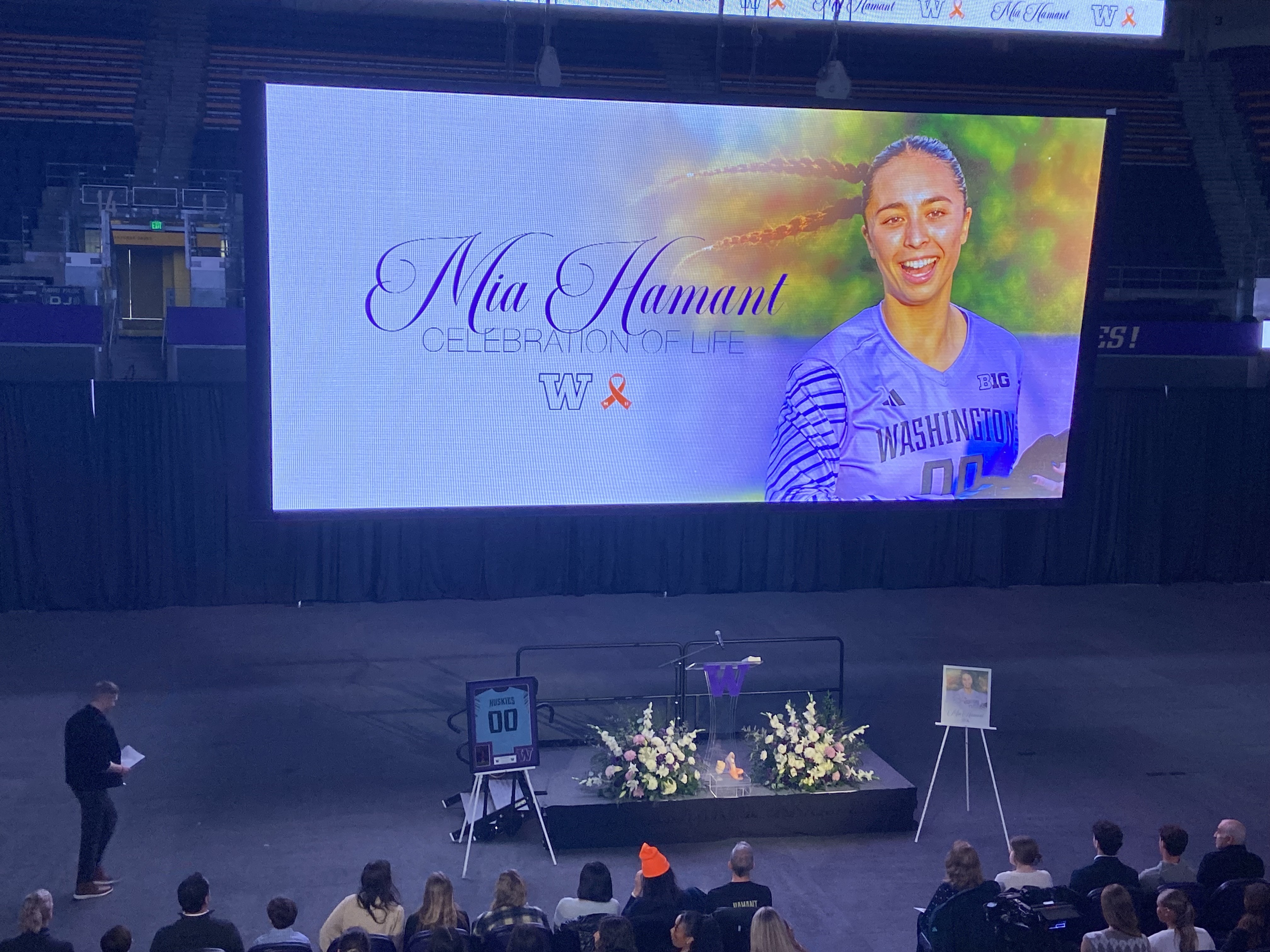 caption: Family, friends, and teammates of University of Washington goalie Mia Hamant gather at her celebration of life at Alaska Airlines Arena on Jan. 6, 2026. 