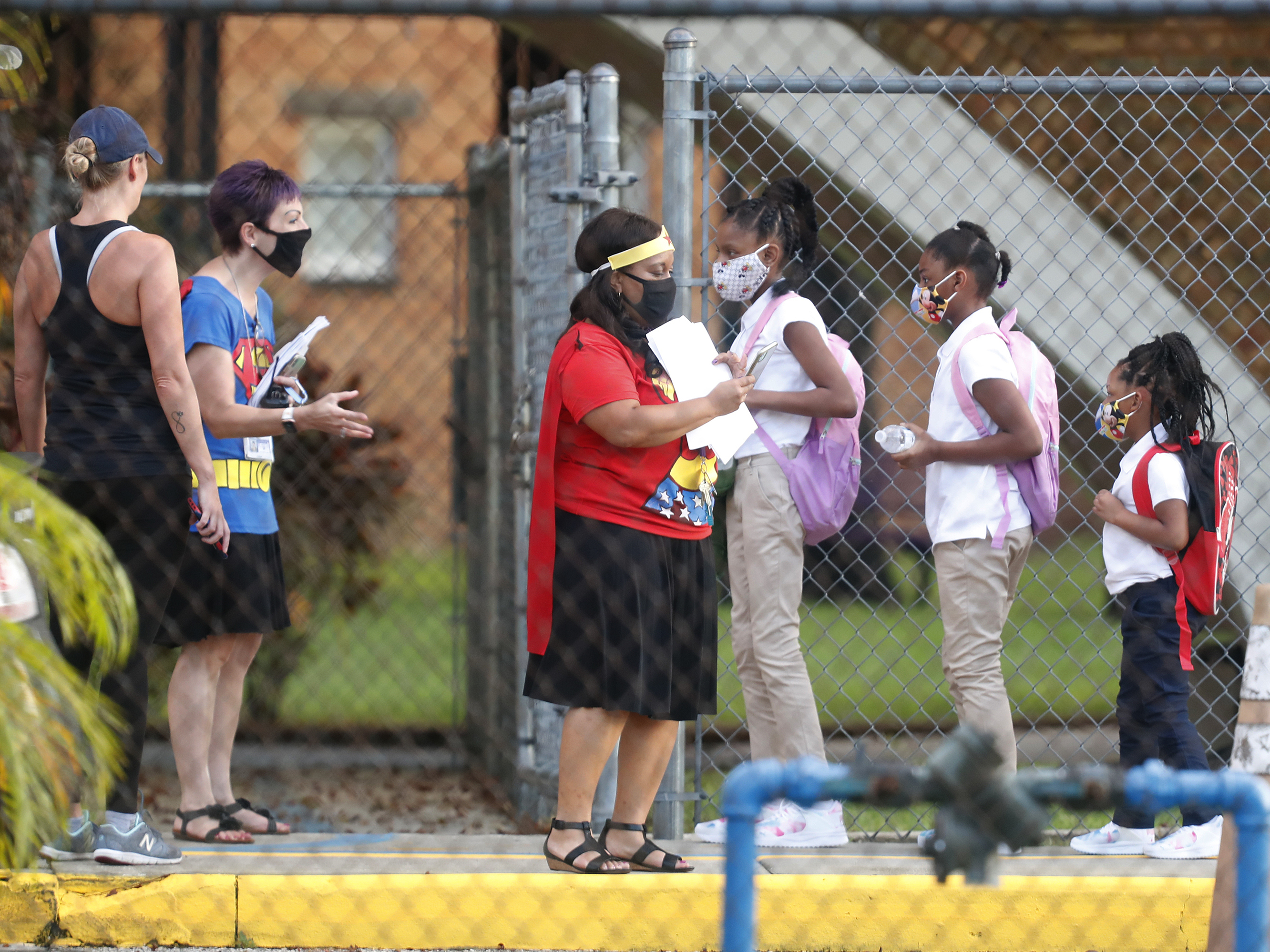 caption: Students return to school at Seminole Heights Elementary in Tampa on Aug. 31, 2020, after the Florida Department of Education mandated in-class learning.