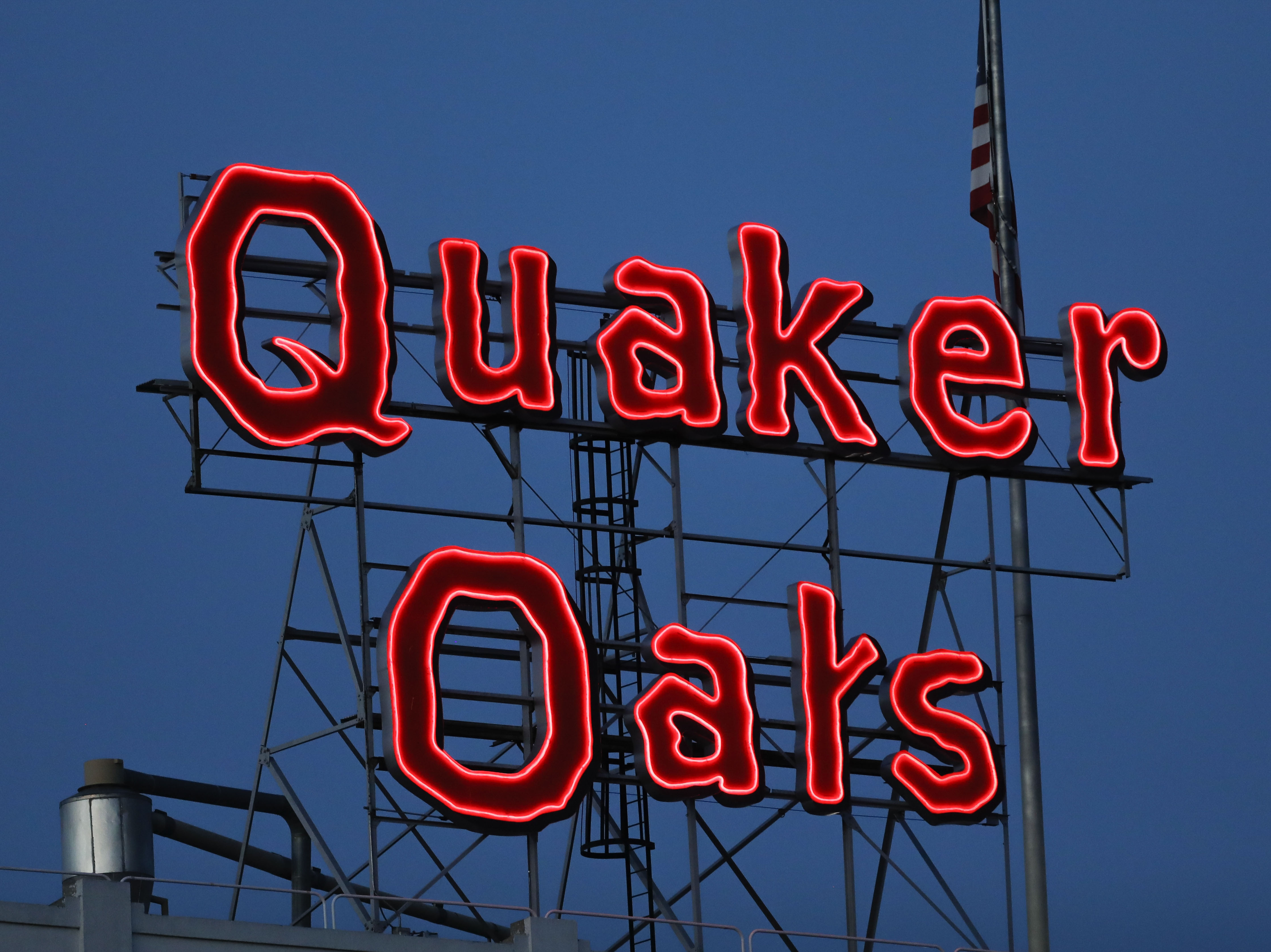 caption: The Quaker Oats sign is seen in Cedar Rapids, Iowa in June 2021. Quaker Oats on Friday, Dec. 15, 2023, recalled several of its granola products, including granola bars and cereals, saying the foods could be contaminated with salmonella.