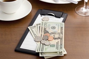 caption: A new rule proposed by the Labor Department would allow employers to require waitstaff and others to share their tips with kitchen staff. But labor advocates say it could allow bosses to take advantage of their workers.
