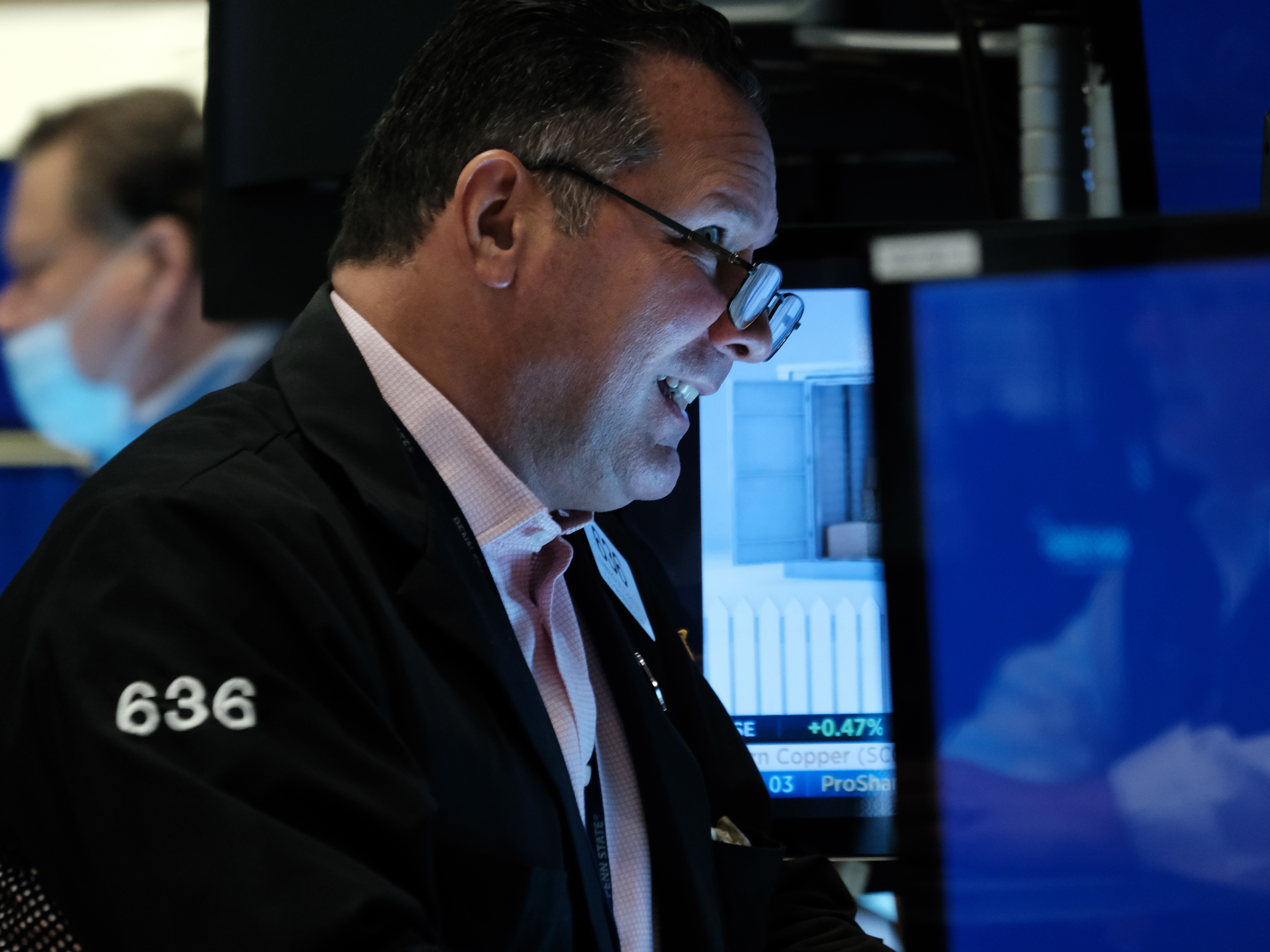 caption: A trader working on the floor of the New York Stock Exchange (NYSE) in New York City on May 2. Stocks surged on Wednesday after the Fed's policy meeting.