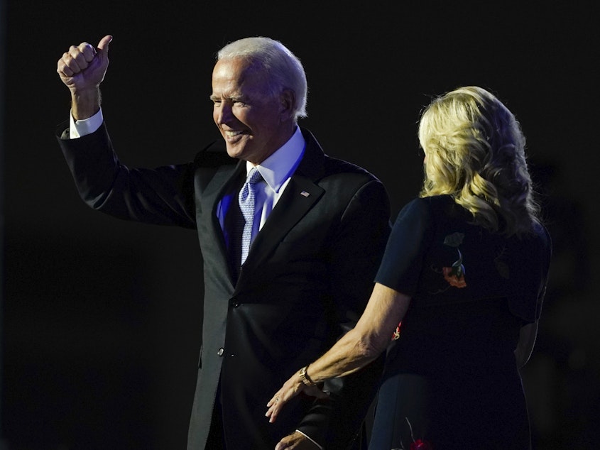 caption: President-elect Joe Biden stands on stage with his wife, Jill Biden, on Saturday in Wilmington, Del. The incoming first lady is an English professor at Northern Virginia Community College.