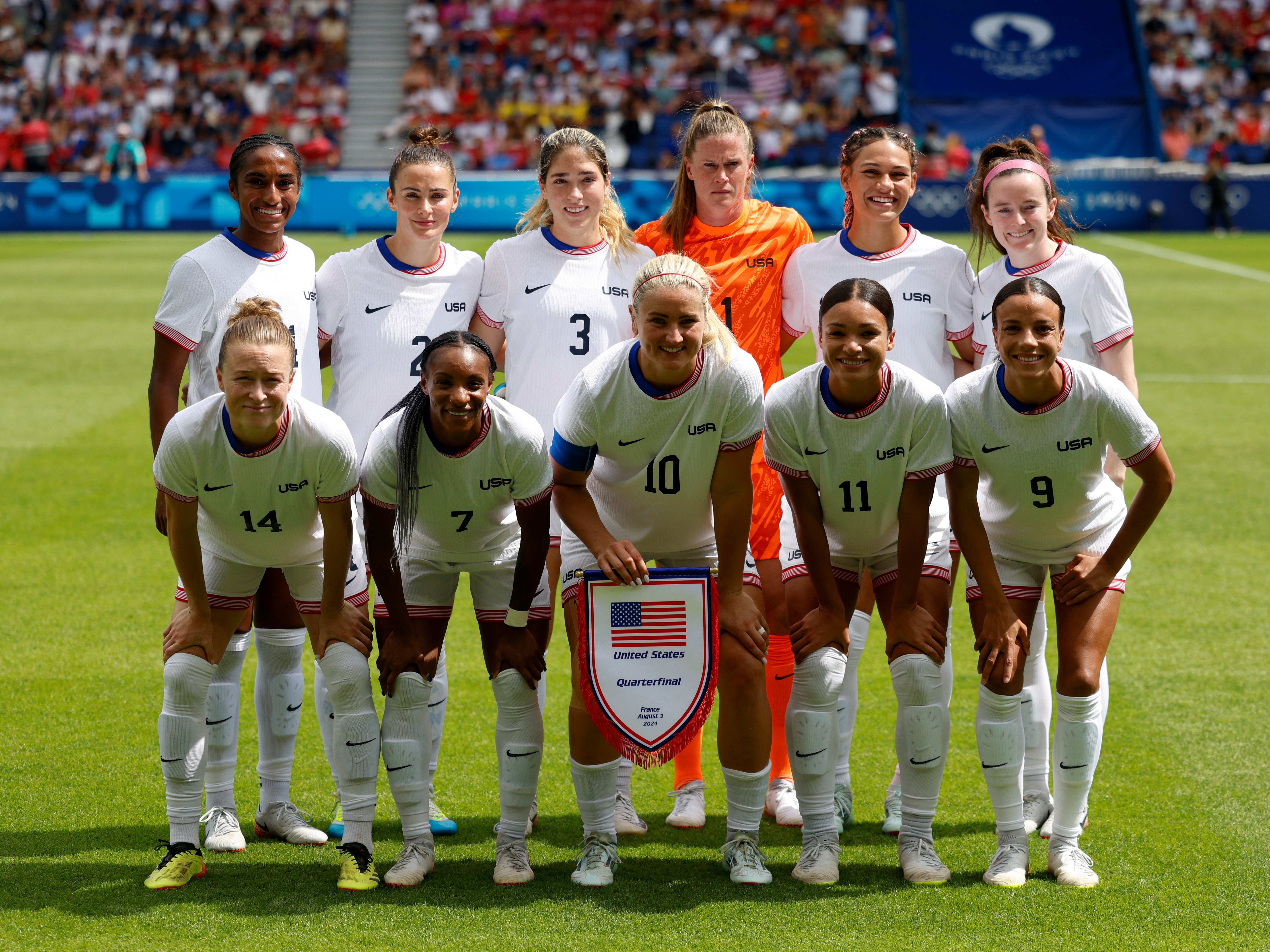 caption: The U.S. women's soccer team poses before the start of the quarterfinal match against Japan last Saturday. The USWNT is playing for Olympic gold on Saturday for the first time since 2012.