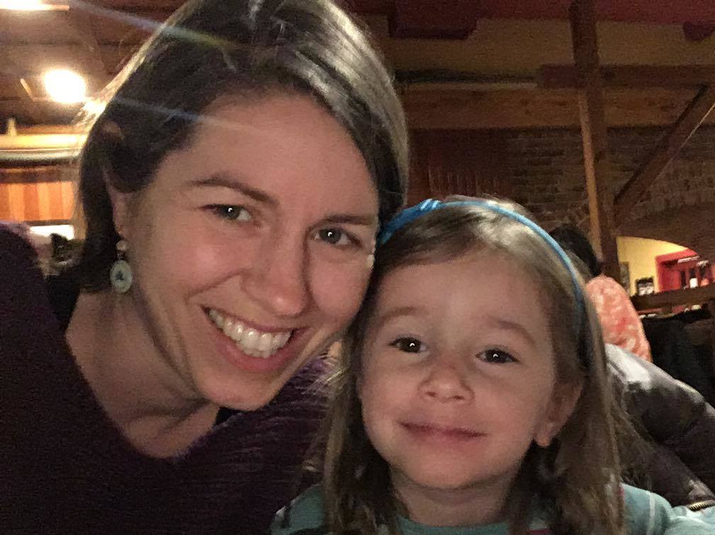 caption: Avery Hoppa with her 3-year-old daughter Zelda. Hoppa says she's "incredibly grateful" that she and her husband still have jobs. But she says it "feels weird to be a consumer right now" as many are struggling financially.